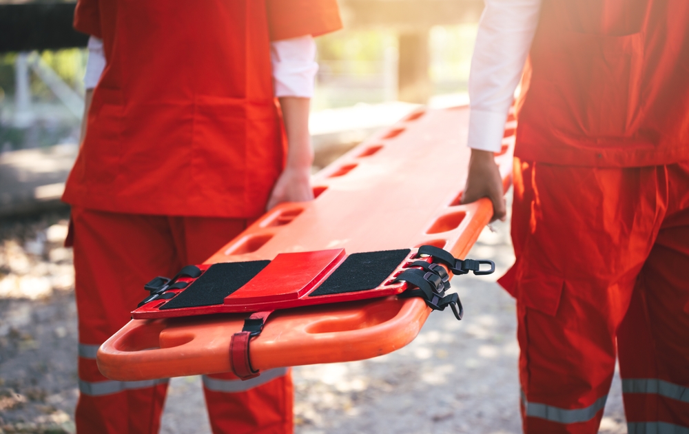 Close,Up,Of,Emergency,Rescue,Team,Holding,Transfer,Stretcher,To