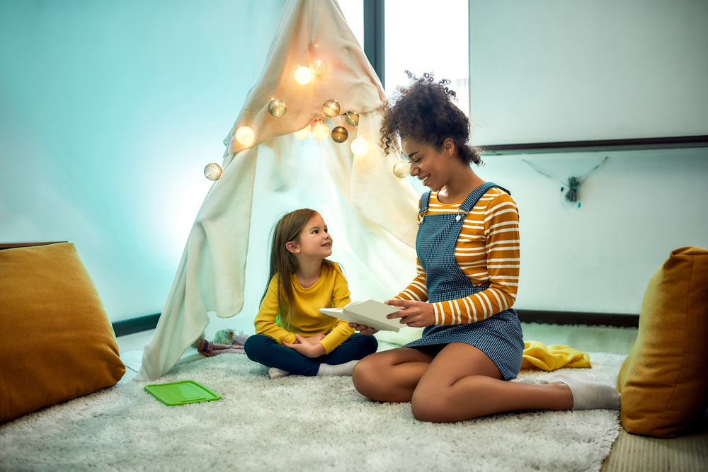 African,American,Woman,Baby,Sitter,Entertaining,Caucasian,Cute,Little,Girl.