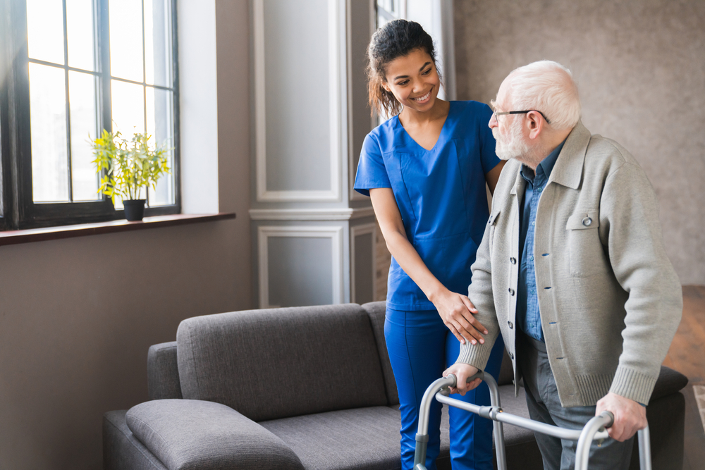 Portrait,Of,An,African,Young,Nurse,Helping,Old,Elderly,Disable