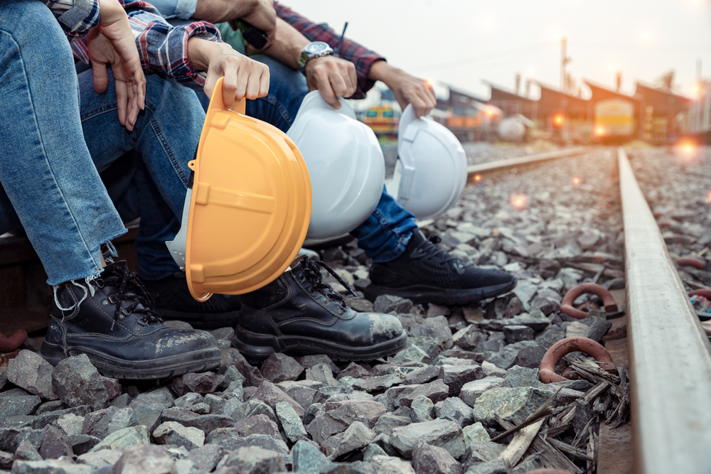 A,Group,Of,Workers,Holding,Hard,Hat,And,Engineers,Rested