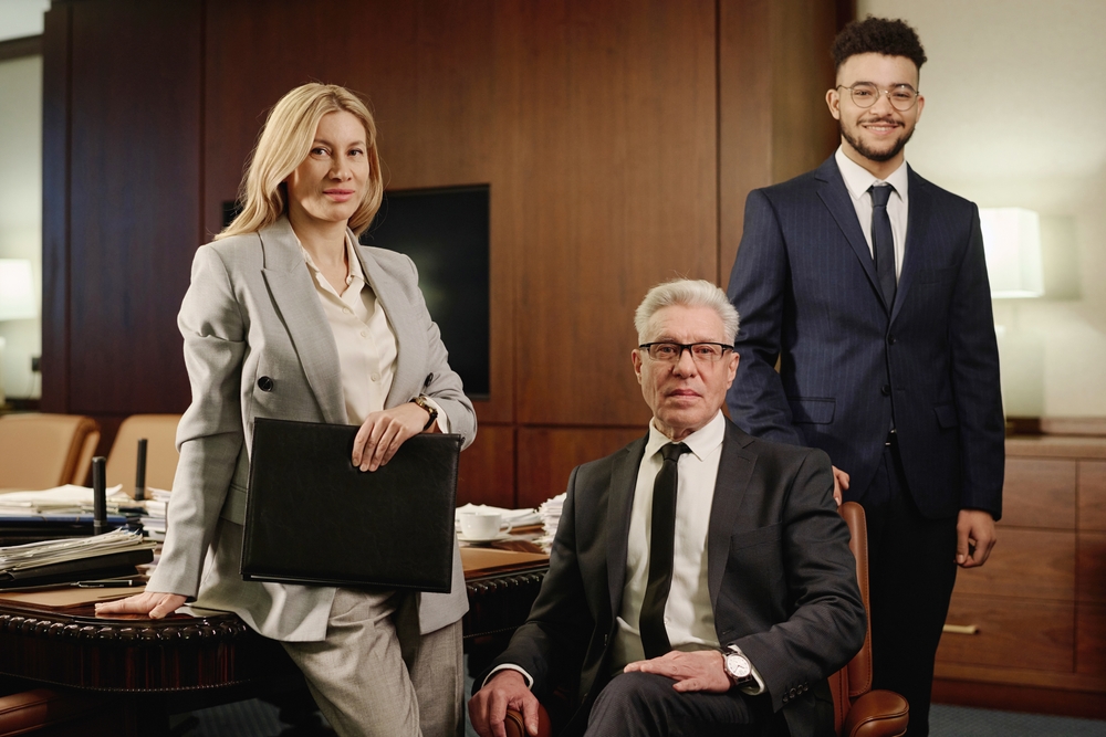 Diverse,Group,Of,Lawyers,Posing,Together,In,Office,Boardroom,And