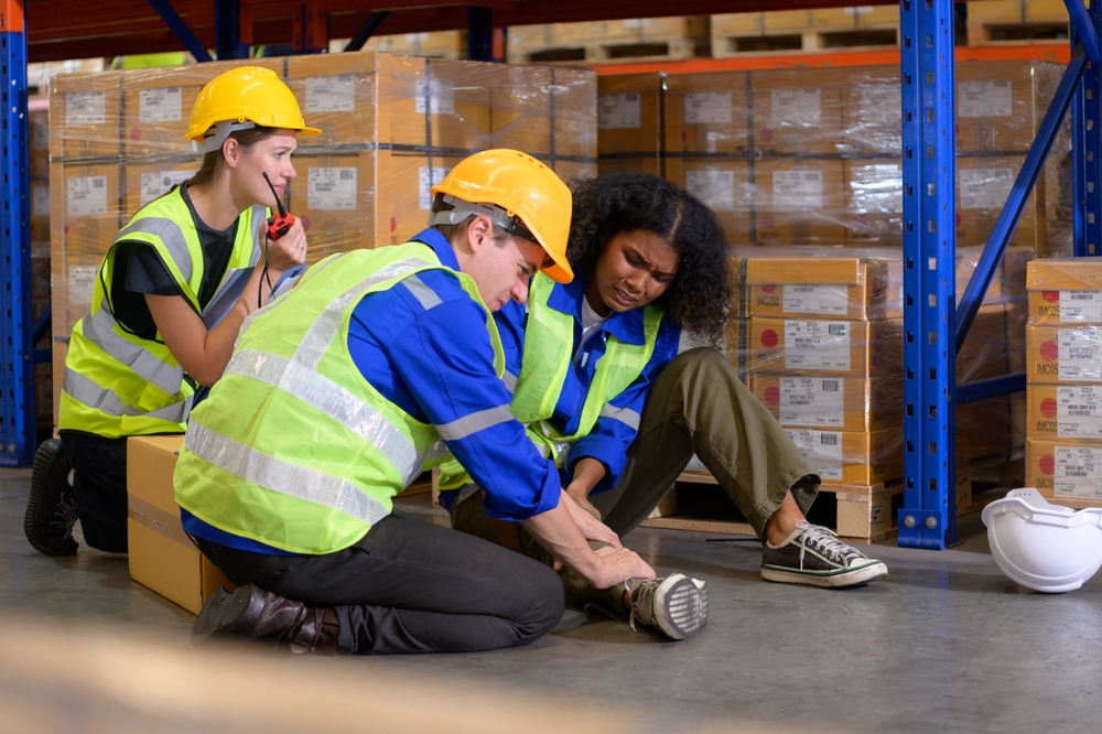 Warehouse,Worker,Injured,In,Leg,,Colleagues,Help,And,Support,To